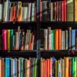 Books on wooden black shelf